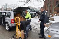 Left to Right-John Hall and Cory Skoczen of the Ohio Turnpike unload MARCS radios as Chief Jeffrey Willis of Ravenna P.D. stands by to receive them Left to Right-John Hall and Cory Skoczen of the Ohio Turnpike unload MARCS radios as Chief Jeffrey Willis of Ravenna P.D. stands by to receive them